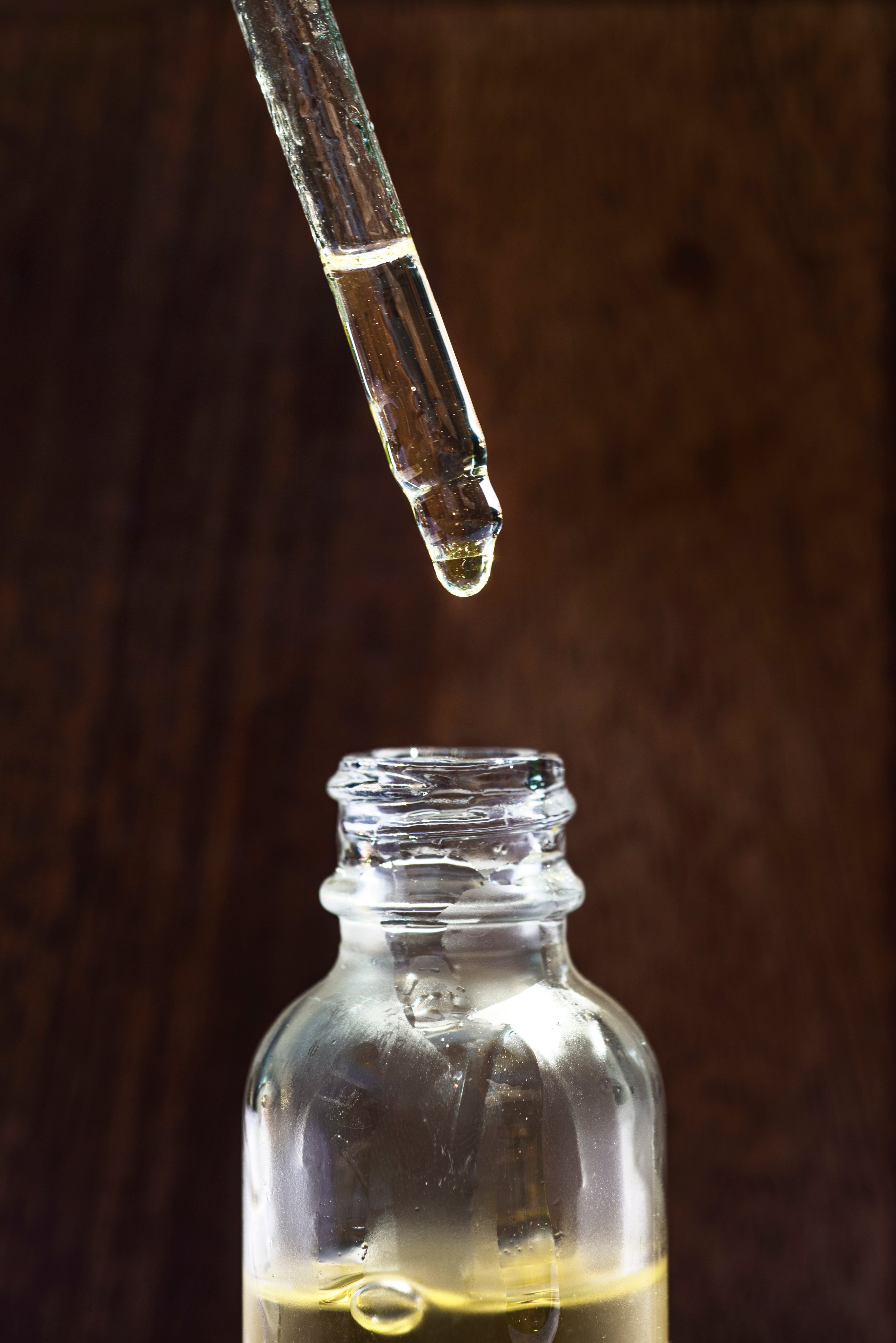 glass-jar-of-face-oil-and-a-dropper-above-it.jpg